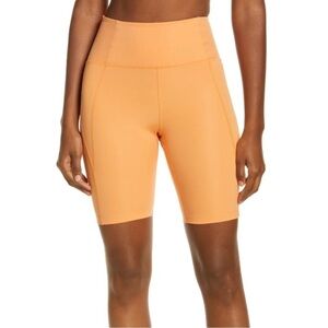 Girlfriend Collective | High Rise Run Bike Shorts Orange Size Medium
